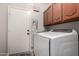 Convenient laundry room with washer, dryer, and ample cabinetry at 15237 S 19Th Way, Phoenix, AZ 85048