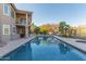 Inviting backyard pool with mature landscaping, mountain views, and spacious deck for outdoor entertaining at 15237 S 19Th Way, Phoenix, AZ 85048