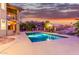 Relaxing rectangular pool with surrounding patio at sunset at 15237 S 19Th Way, Phoenix, AZ 85048