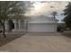 White stucco house with a two-car garage and desert landscaping at 15869 E Ponderosa Dr, Fountain Hills, AZ 85268