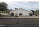 View of the home's side elevation, showcasing its stucco exterior and landscaping at 15869 E Ponderosa Dr, Fountain Hills, AZ 85268