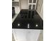 Modern kitchen island with black granite countertop at 15869 E Ponderosa Dr, Fountain Hills, AZ 85268