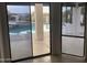 Living room with marble floors, fireplace, and sliding doors to patio at 15869 E Ponderosa Dr, Fountain Hills, AZ 85268