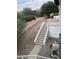 Stairs leading to the backyard, with a storage shed and pool equipment visible at 15869 E Ponderosa Dr, Fountain Hills, AZ 85268