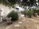 Landscaped yard with stone pathway and a large potted plant, leading to the pool at 15869 E Ponderosa Dr, Fountain Hills, AZ 85268