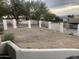 Front yard with gravel landscaping and a white fence, offering privacy at 15869 E Ponderosa Dr, Fountain Hills, AZ 85268