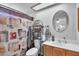 Bathroom with a shower/tub combo, vanity, and linen storage at 1604 W Kerry Ln, Phoenix, AZ 85027