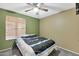 Serene bedroom featuring a ceiling fan and window blinds at 1604 W Kerry Ln, Phoenix, AZ 85027