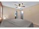 Bright bedroom with ceiling fan and access to bathroom at 1604 W Kerry Ln, Phoenix, AZ 85027