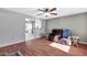 Living room with hardwood floors, a recliner, and ceiling fan at 1604 W Kerry Ln, Phoenix, AZ 85027