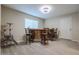 Bar area with a wooden bar top and four bar stools at 1637 W Tierra Buena Ln, Phoenix, AZ 85023