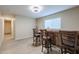 Bar area with a wooden bar top and four bar stools at 1637 W Tierra Buena Ln, Phoenix, AZ 85023