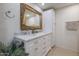 Bathroom with double vanity, marble countertop, and large mirror at 1637 W Tierra Buena Ln, Phoenix, AZ 85023