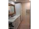 Bathroom with double vanity and marble countertop at 1637 W Tierra Buena Ln, Phoenix, AZ 85023