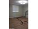 Bedroom with wood-look flooring and window blinds at 1637 W Tierra Buena Ln, Phoenix, AZ 85023