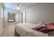 Bedroom with a bed, mirrored closet doors, and ceiling fan at 1637 W Tierra Buena Ln, Phoenix, AZ 85023