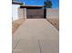 Driveway with brown gate and block walls at 1637 W Tierra Buena Ln, Phoenix, AZ 85023