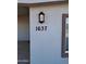 House number 1637 with a modern black lantern at 1637 W Tierra Buena Ln, Phoenix, AZ 85023