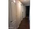 Home hallway with wood-look flooring and neutral-colored walls at 1637 W Tierra Buena Ln, Phoenix, AZ 85023