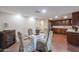 Modern kitchen with dark wood cabinets and granite countertops at 1637 W Tierra Buena Ln, Phoenix, AZ 85023