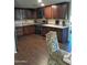 Modern kitchen with dark wood cabinets and granite counters at 1637 W Tierra Buena Ln, Phoenix, AZ 85023