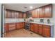 Updated kitchen featuring stainless steel appliances and wood cabinets at 1637 W Tierra Buena Ln, Phoenix, AZ 85023