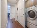 Laundry room with washer, dryer, and built-in cabinets at 1637 W Tierra Buena Ln, Phoenix, AZ 85023