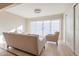 Sunlit living room featuring a sofa and chairs, plus sliding glass doors at 1637 W Tierra Buena Ln, Phoenix, AZ 85023