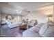 Spacious living room featuring hardwood floors, neutral decor, and a cozy atmosphere at 1637 W Tierra Buena Ln, Phoenix, AZ 85023