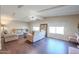 Living room with hardwood floors and large windows offering natural light at 1637 W Tierra Buena Ln, Phoenix, AZ 85023