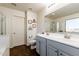 Bathroom with double vanity and gray cabinets at 1647 W Gold Mine Way, San Tan Valley, AZ 85144