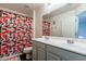 Bathroom with double vanity and peach-colored shower curtain at 1647 W Gold Mine Way, San Tan Valley, AZ 85144