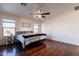 Primary bedroom with wood floors and ceiling fan at 1647 W Gold Mine Way, San Tan Valley, AZ 85144