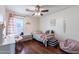 bedroom with twin bed, beanbag chair, and hardwood floors at 1647 W Gold Mine Way, San Tan Valley, AZ 85144