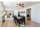 Dining room with a large table, six chairs, and view of kitchen at 1647 W Gold Mine Way, San Tan Valley, AZ 85144