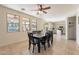 Bright dining room with a table and chairs, adjacent to kitchen at 1647 W Gold Mine Way, San Tan Valley, AZ 85144