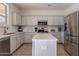 Spacious kitchen featuring modern appliances and an island at 1647 W Gold Mine Way, San Tan Valley, AZ 85144