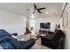 Living room with two comfy sofas, a coffee table, and a large TV at 1647 W Gold Mine Way, San Tan Valley, AZ 85144