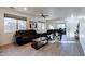 Living room with two sofas, a coffee table, and large windows at 1647 W Gold Mine Way, San Tan Valley, AZ 85144