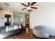 Upstairs loft area with a couch, beanbag chair, and ceiling fan at 1647 W Gold Mine Way, San Tan Valley, AZ 85144