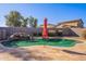 Refreshing kidney-shaped pool with a patio and umbrella at 1647 W Gold Mine Way, San Tan Valley, AZ 85144