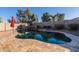 Private backyard oasis featuring a kidney-shaped pool and waterfall at 1647 W Gold Mine Way, San Tan Valley, AZ 85144