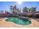 Inviting kidney-shaped pool with a waterfall feature at 1647 W Gold Mine Way, San Tan Valley, AZ 85144