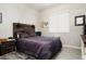 Spacious bedroom with rustic wood headboard and grey bedding at 16747 W Cielo Grande Ave, Surprise, AZ 85387