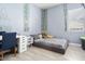 Cozy bedroom with a gray platform bed and a desk at 16747 W Cielo Grande Ave, Surprise, AZ 85387