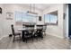 Bright dining room with farmhouse table and black chairs at 16747 W Cielo Grande Ave, Surprise, AZ 85387