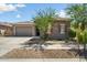 Single-story home with a two-car garage and desert landscaping at 16747 W Cielo Grande Ave, Surprise, AZ 85387