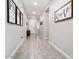 Bright foyer with tile flooring and contemporary wall decor at 16747 W Cielo Grande Ave, Surprise, AZ 85387