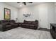 Living room with two brown reclining sofas at 16747 W Cielo Grande Ave, Surprise, AZ 85387