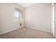 Bright bedroom with window, closet, and carpet flooring at 17528 W East Wind Ave, Goodyear, AZ 85338